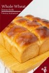 dinner rolls on a wooden board.