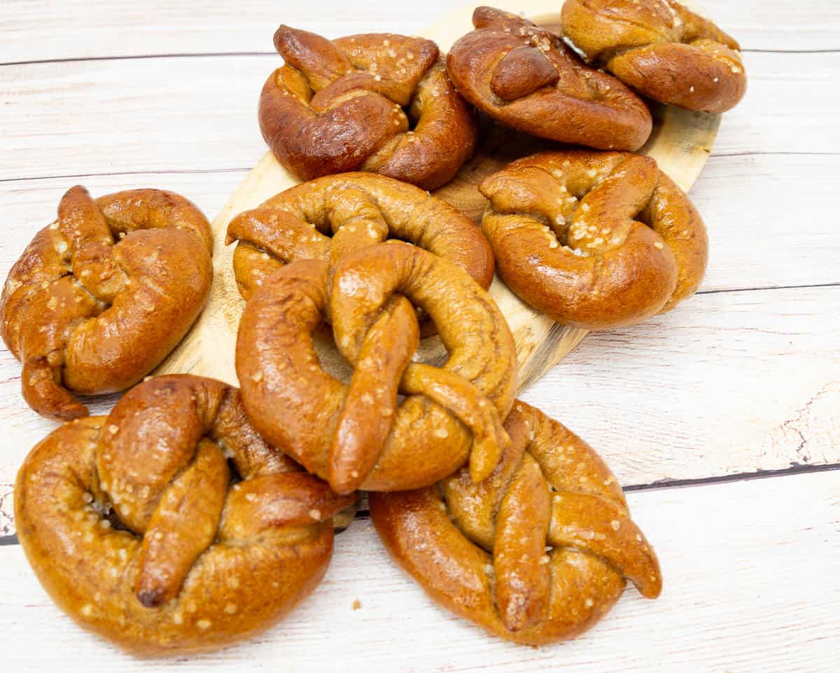 A stack of whole wheat Pretzels on a wooden table.