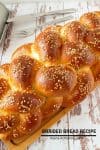 Challah bread on a wooden board.
