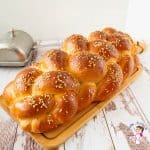 Challah bread on a wooden board.
