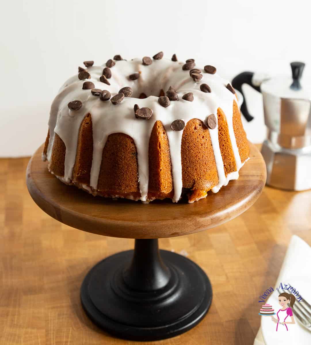 Chocolate chip pumpkin cake on a cake stand.