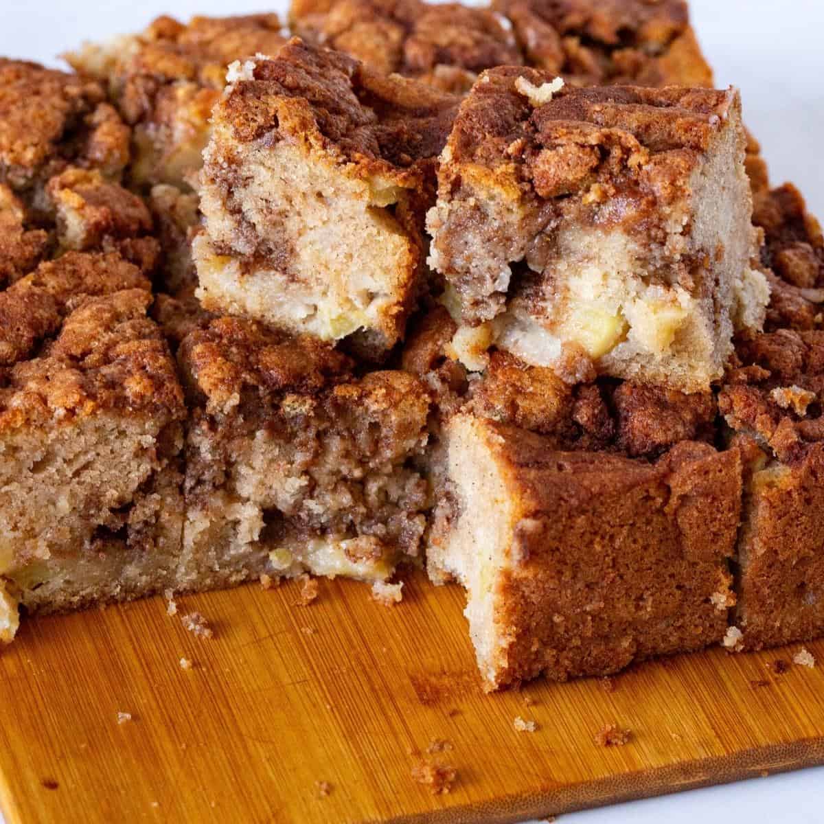 Squares of apple cake on a board.