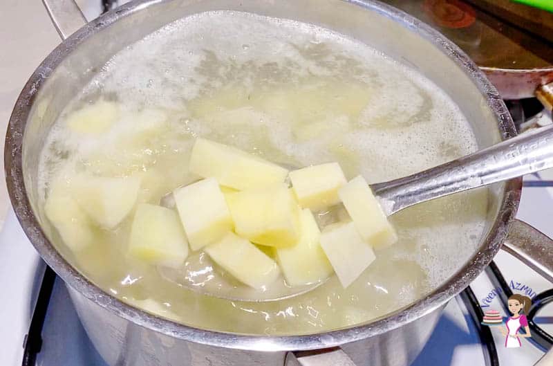 Parboil the potatoes in salted water
