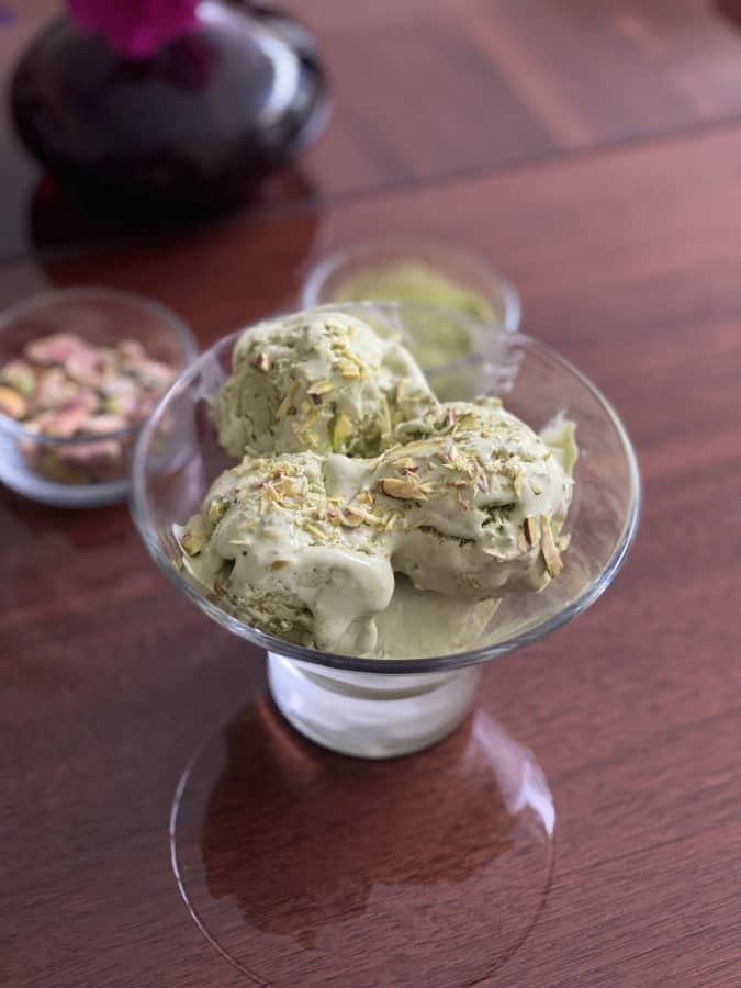 A small bowl of pistachio macha ice cream.