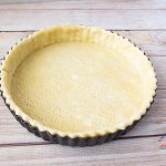 A pie crust in a pie pan.
