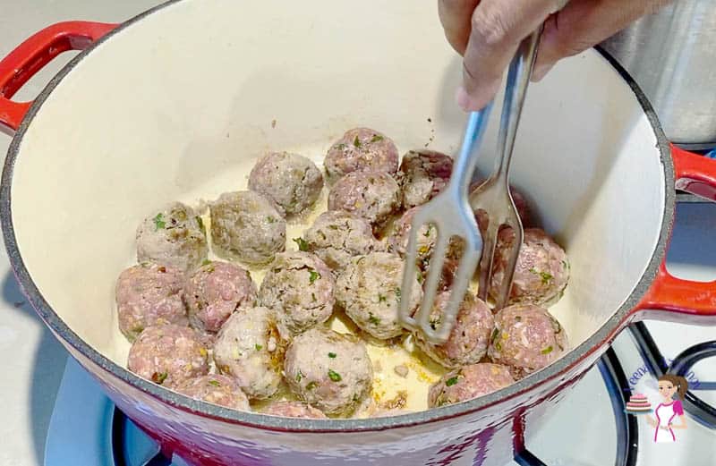 Sear the meatballs in oil on all sides