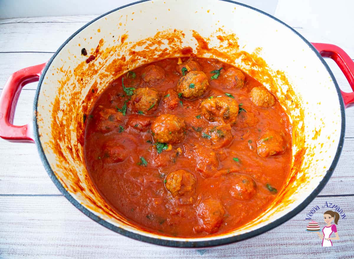 A bowl of Meatballs in pasta sauce.