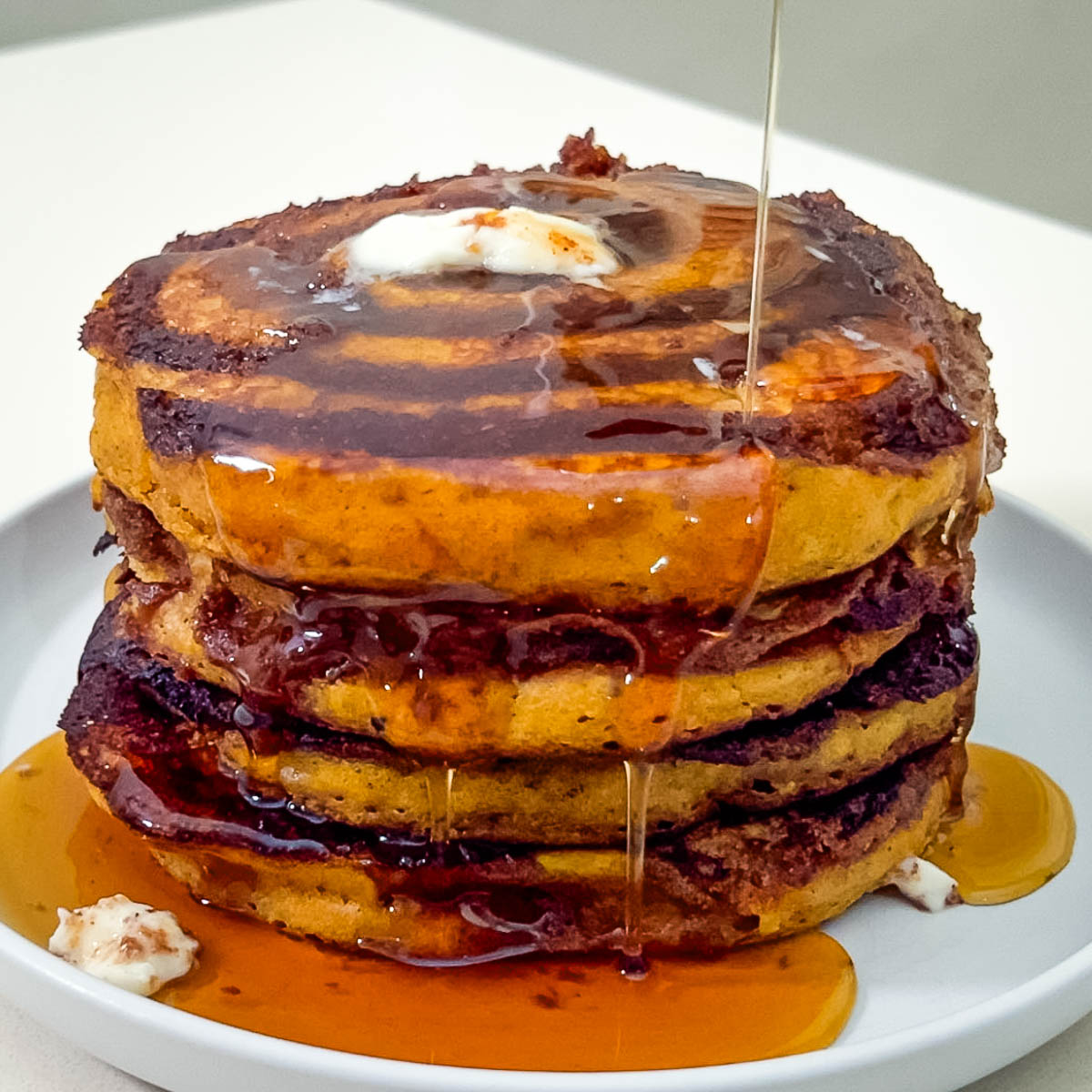 A stack of cinnamon siwrl pancakes.