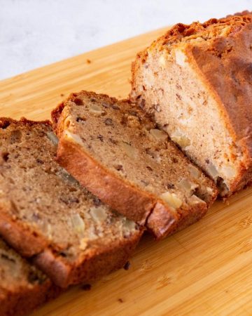 An apple bread cake with fresh apples.