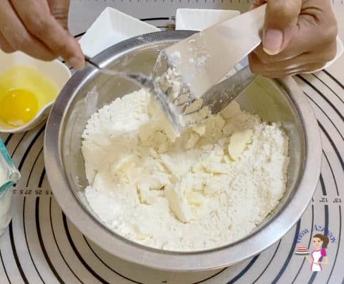 Cut the butter into the flour with a pastry blender
