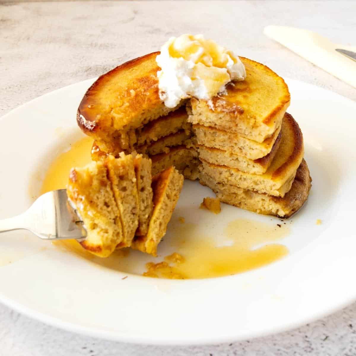 Stack of pancakes cut into small pieces.