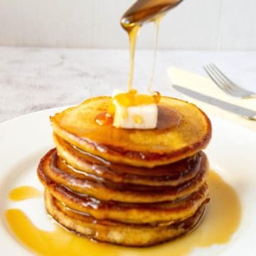 Stack of pancakes with maple syrup.