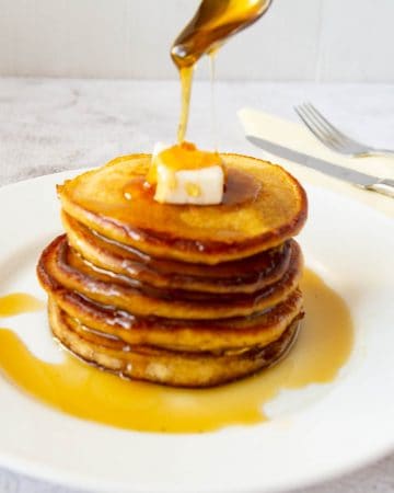 A stack of pancake on a plate, with Pancake and Pumpkin