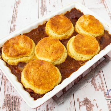 A casserole with lamb topped with biscuits