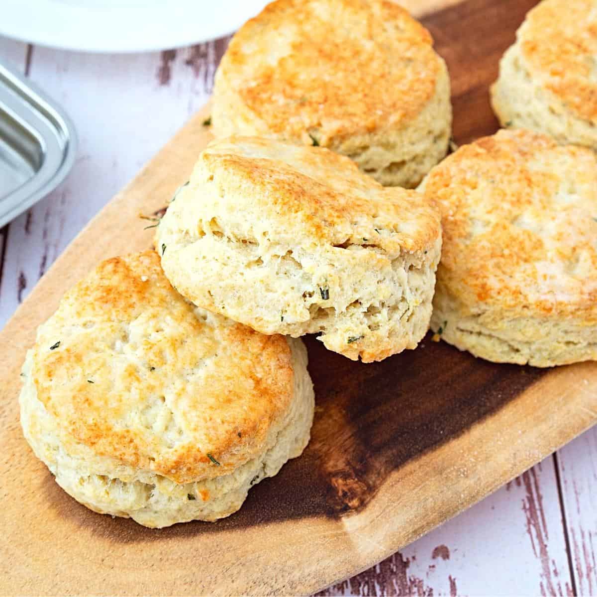 Biscuits with cheddar cheese on a table.