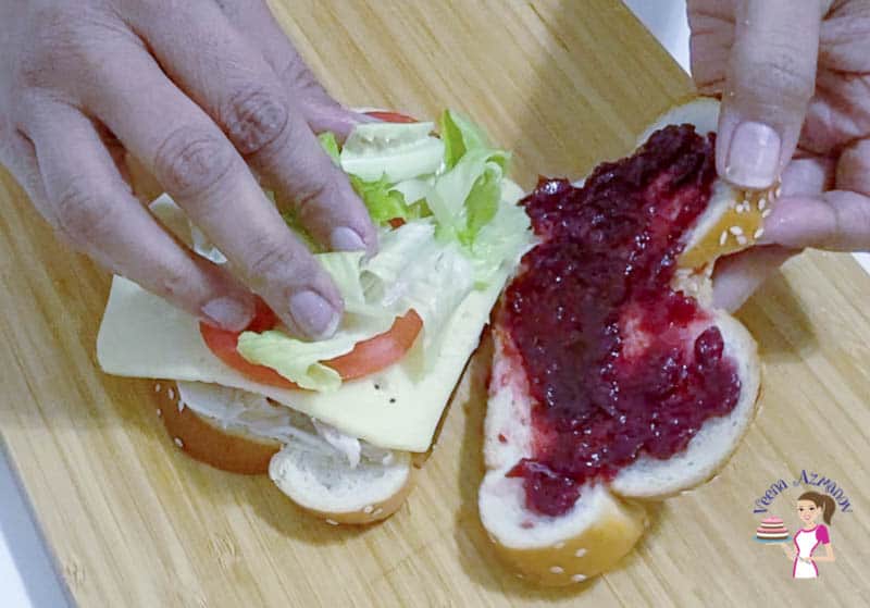 An open sandwich with cranberry sauce