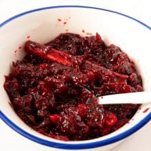 A bowl with cranberry sauce.