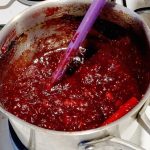 A saucepan with cranberry sauce.