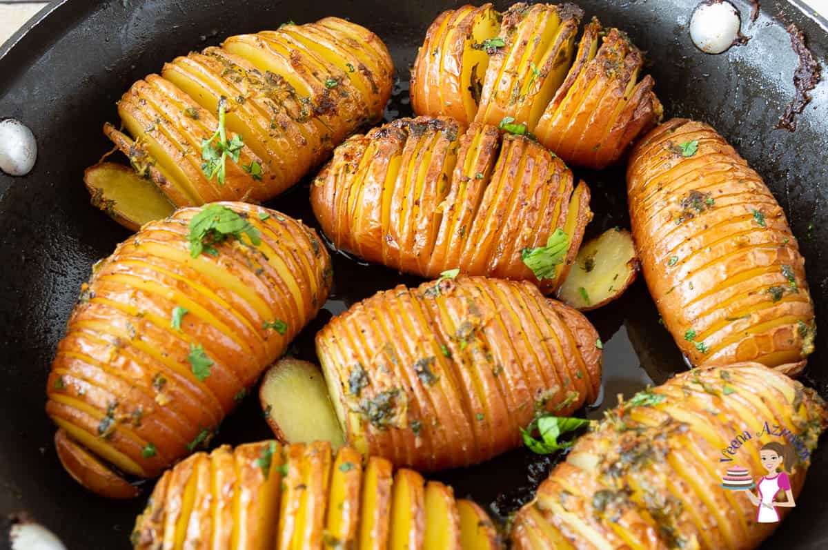 Closeup of Hasselback potatoes in the skillet