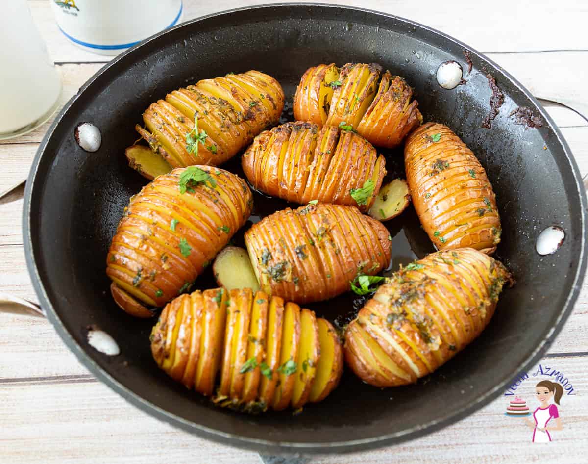 skillet with accordion style potatoes called hasselback
