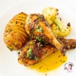 A plate with chicken potato and cauliflower