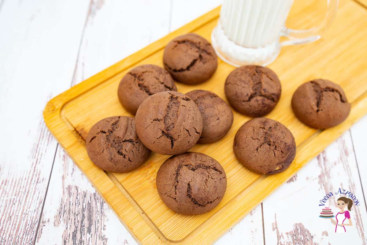 Chocolate cardamom coffee cookies on a wooden board