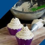 A frosted cupcakes with coffee
