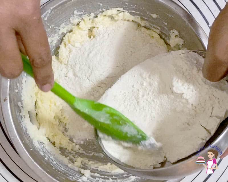 Add flour to the spritz cookie dough