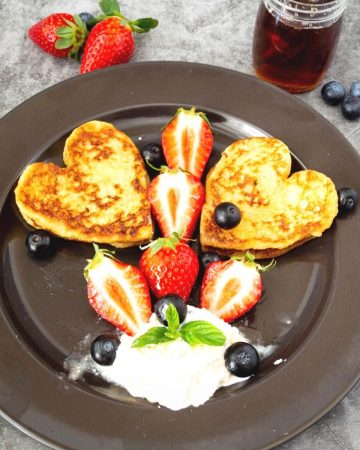 Heart shaped French toast on a plate.