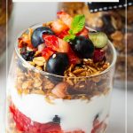 Pinterest image for a parfait made with granola and yogurt.