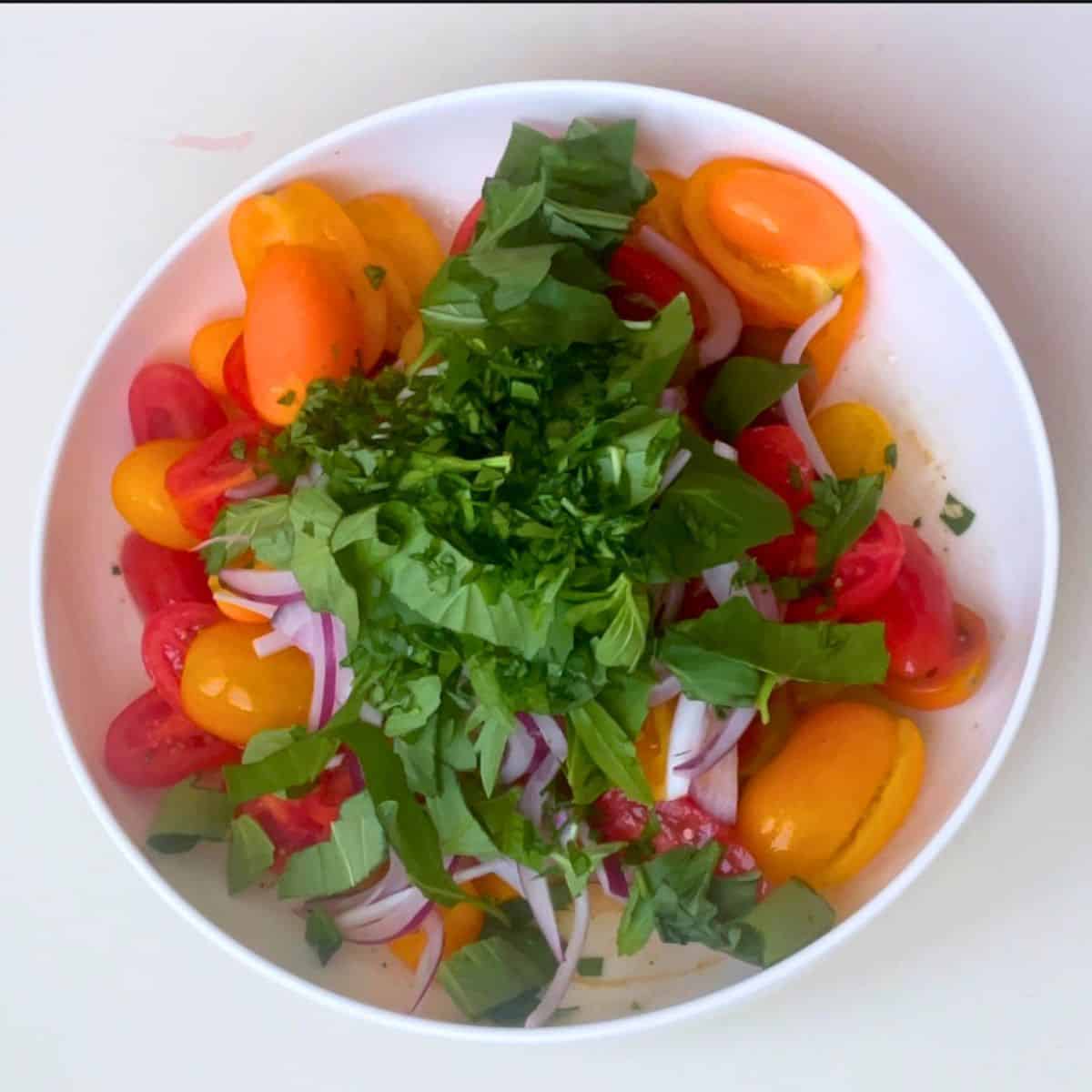Combine all the salad ingredients in a bowl.