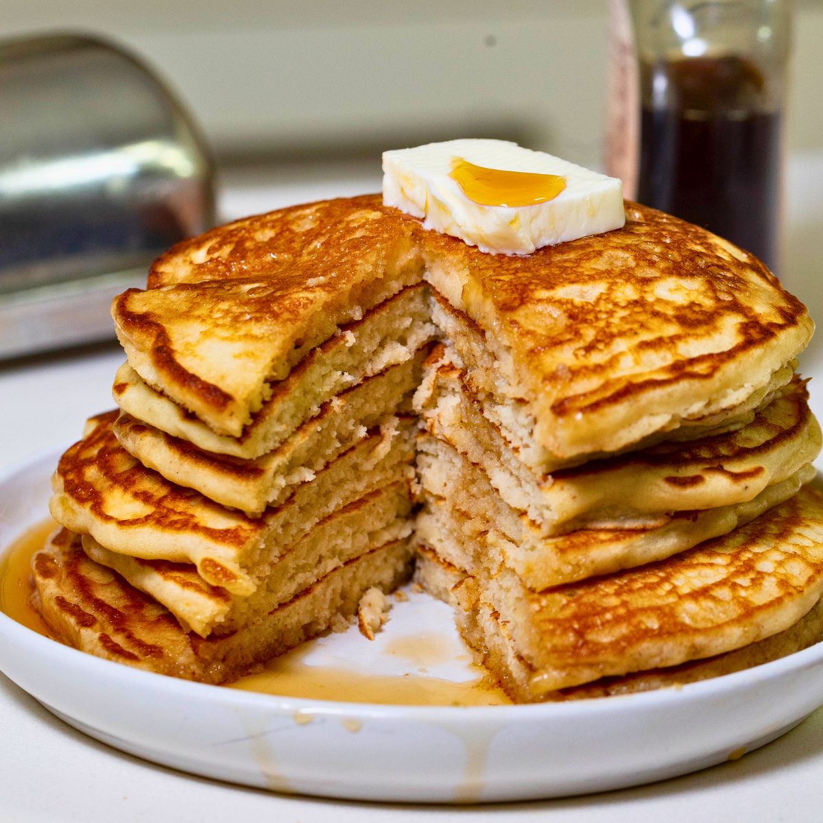 stack of homemade buttermilk pancakes with maple syrup