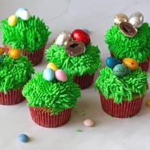 Cupcakes with green grass and Easter eggs.