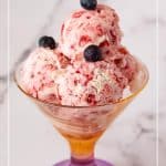 A glass with ice cream scoops.