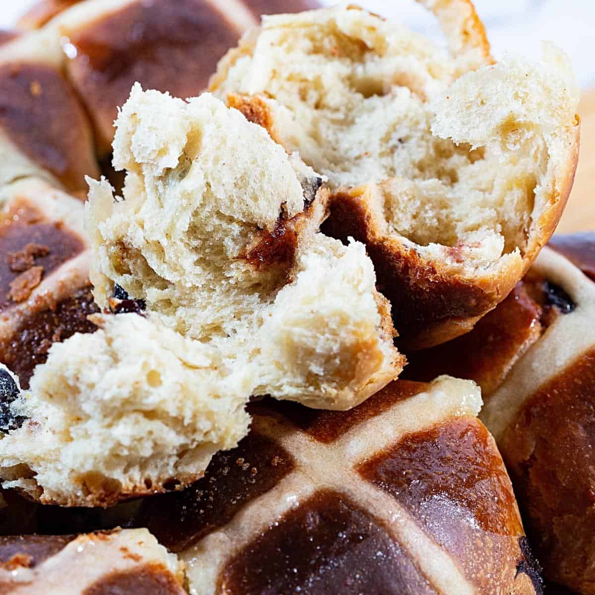 Showing the fluffy inside of the hot cross buns.