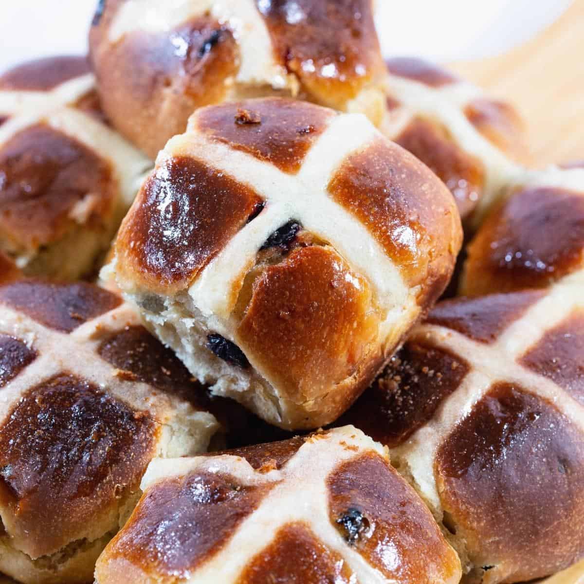 Stack of spiced buns for Good Friday with cross.