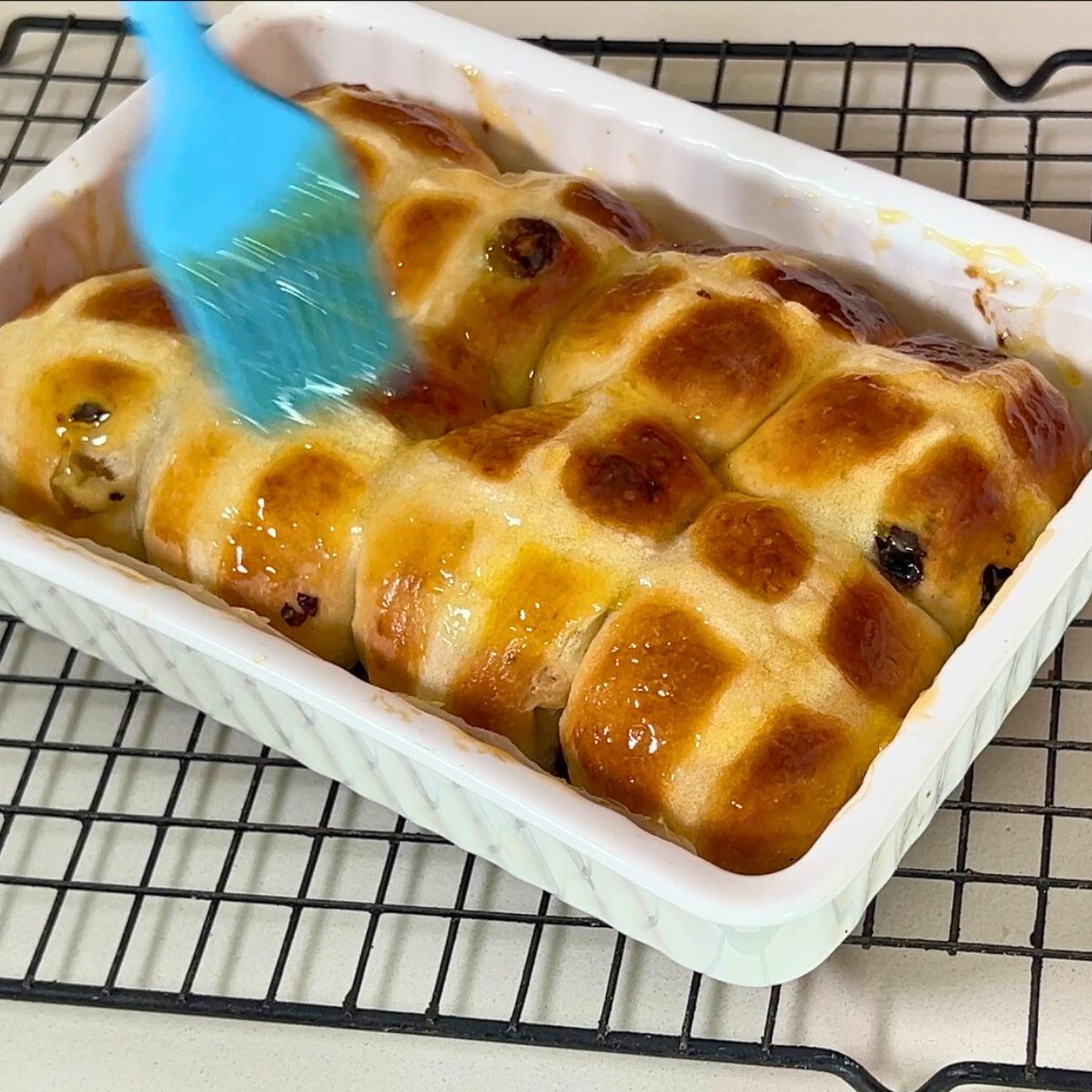 Brush hot cross buns with apricot jam or melted butter.