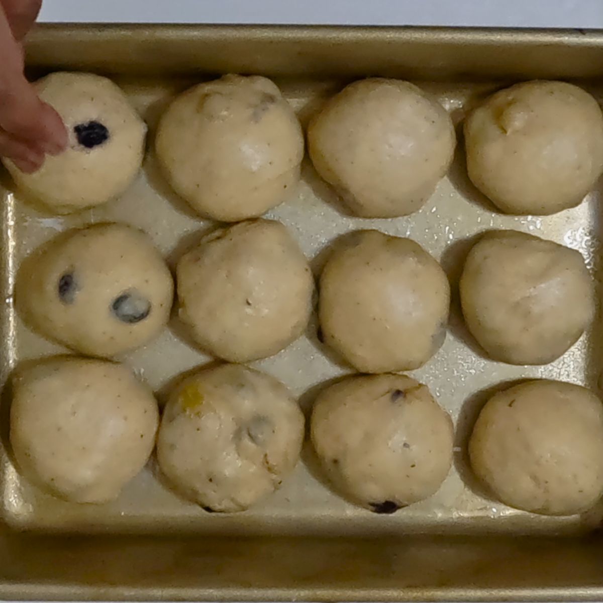 Sweet Buns rising in the baking pan.