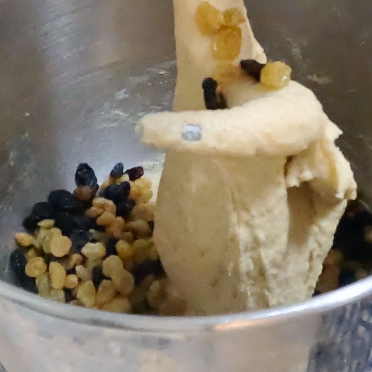 Add raisins to the sweet dough for hot cross buns.