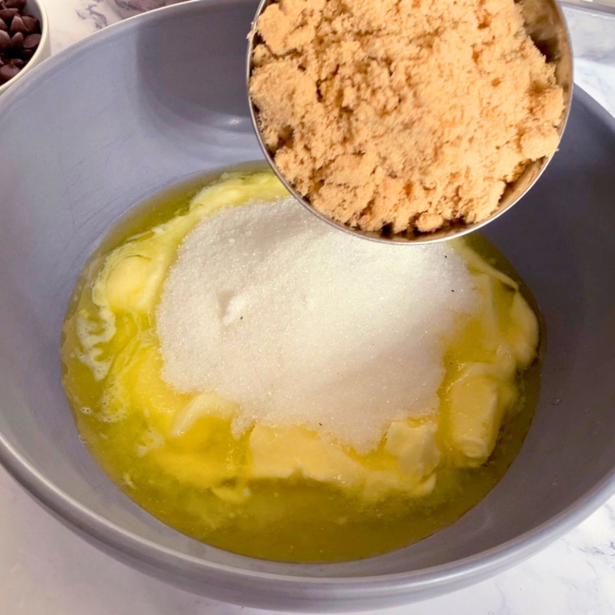 A bowl with melted butter and sugars.