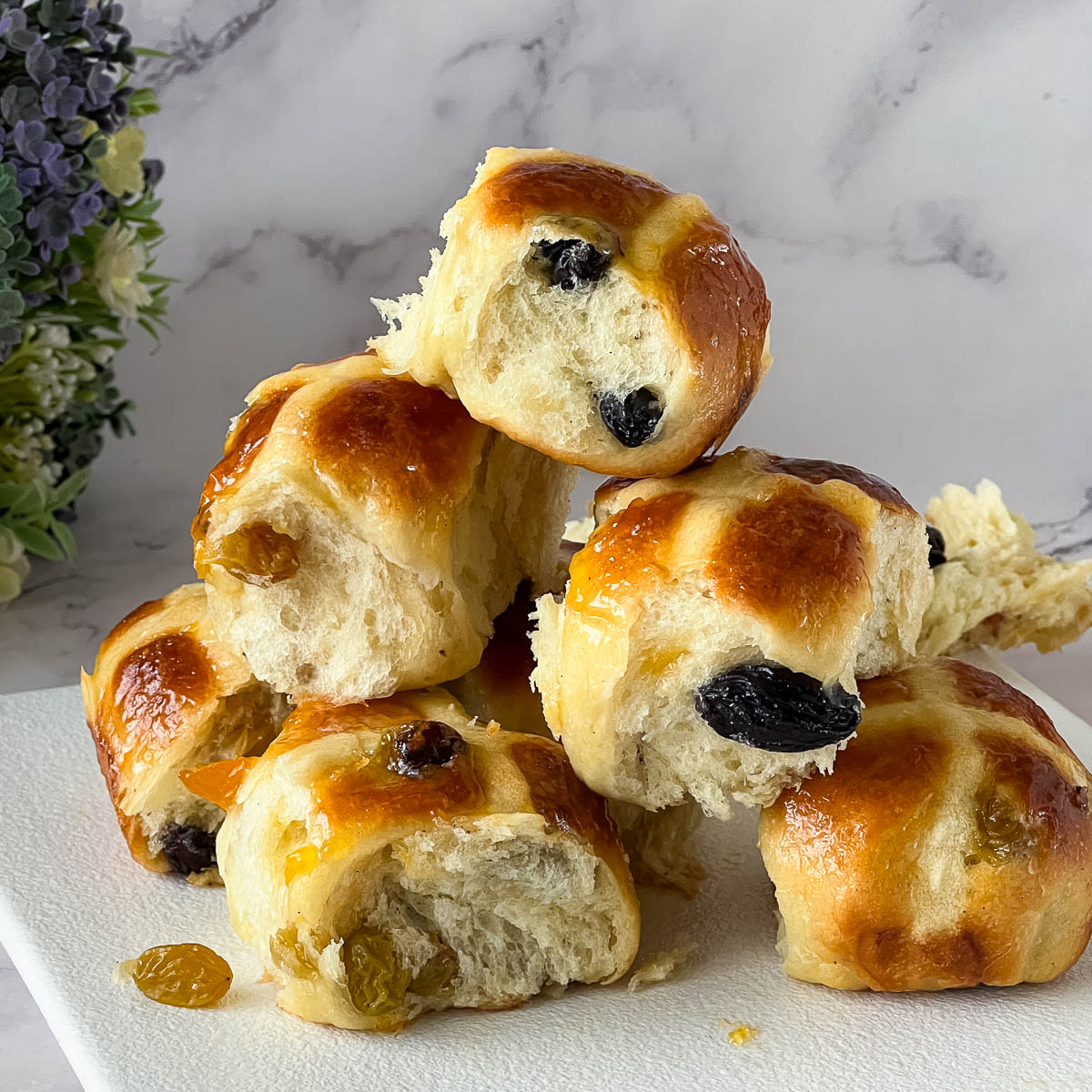 A Stack of Hot Cross buns on the platter.