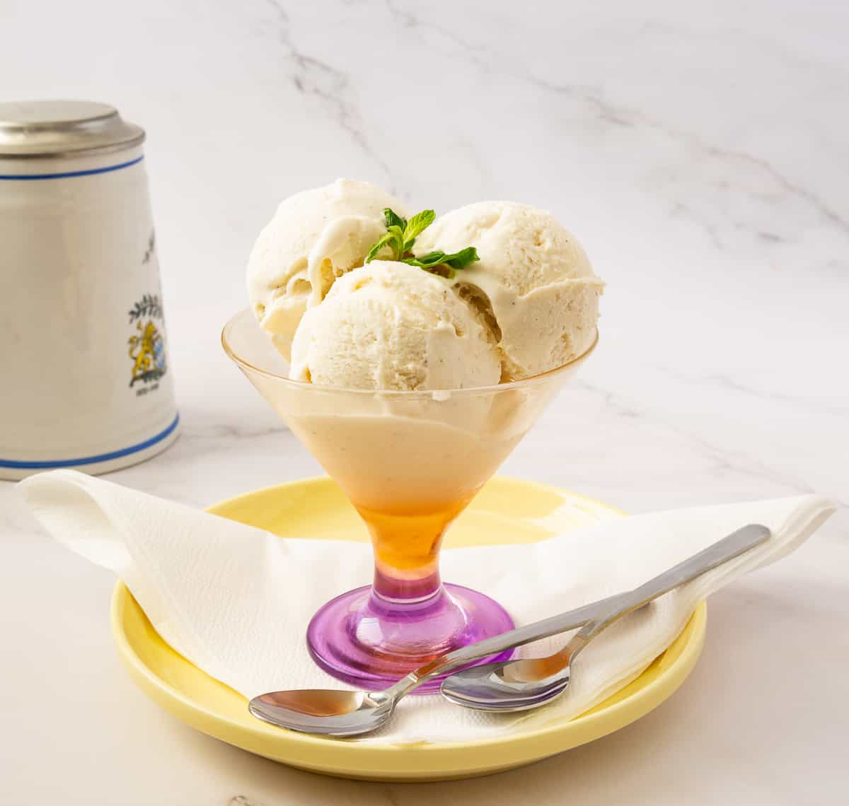 A bowl with vanilla ice cream.