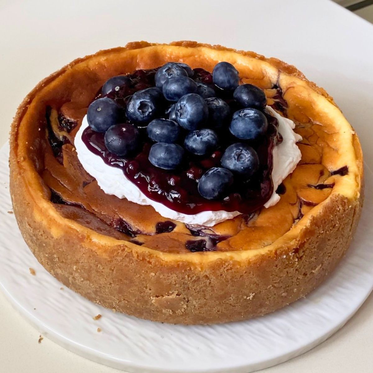 A baked cheesecake on the table.
