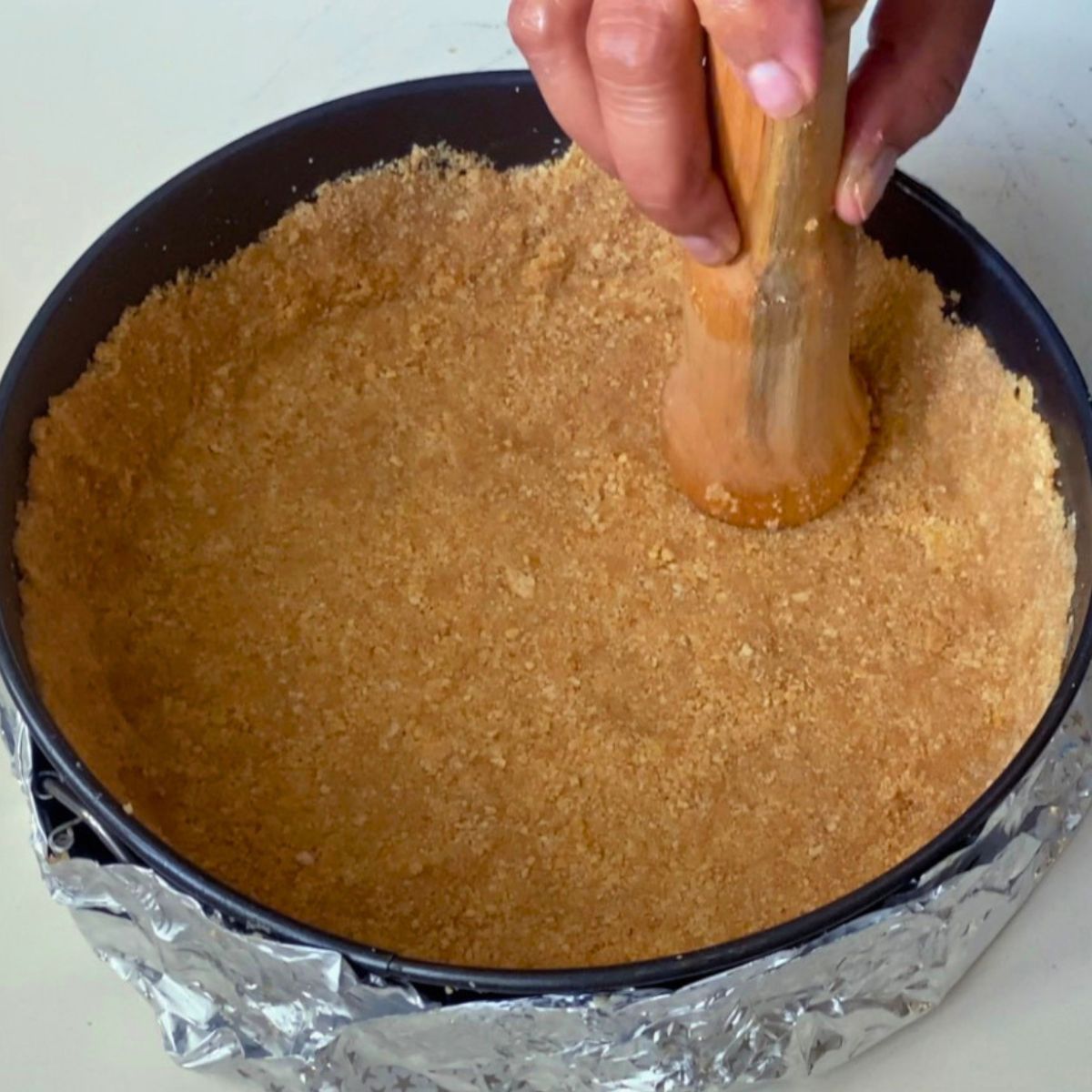 A cheesecake springform with cookie crust.
