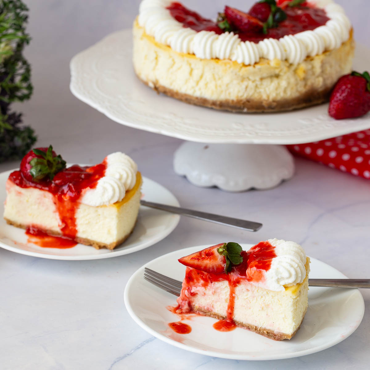 A frosted cheesecake on the table.