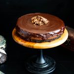 A cheesecake on the cake stand.
