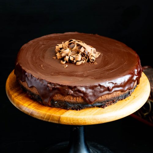 Cake with chocolate cheesecake with a ganache top.