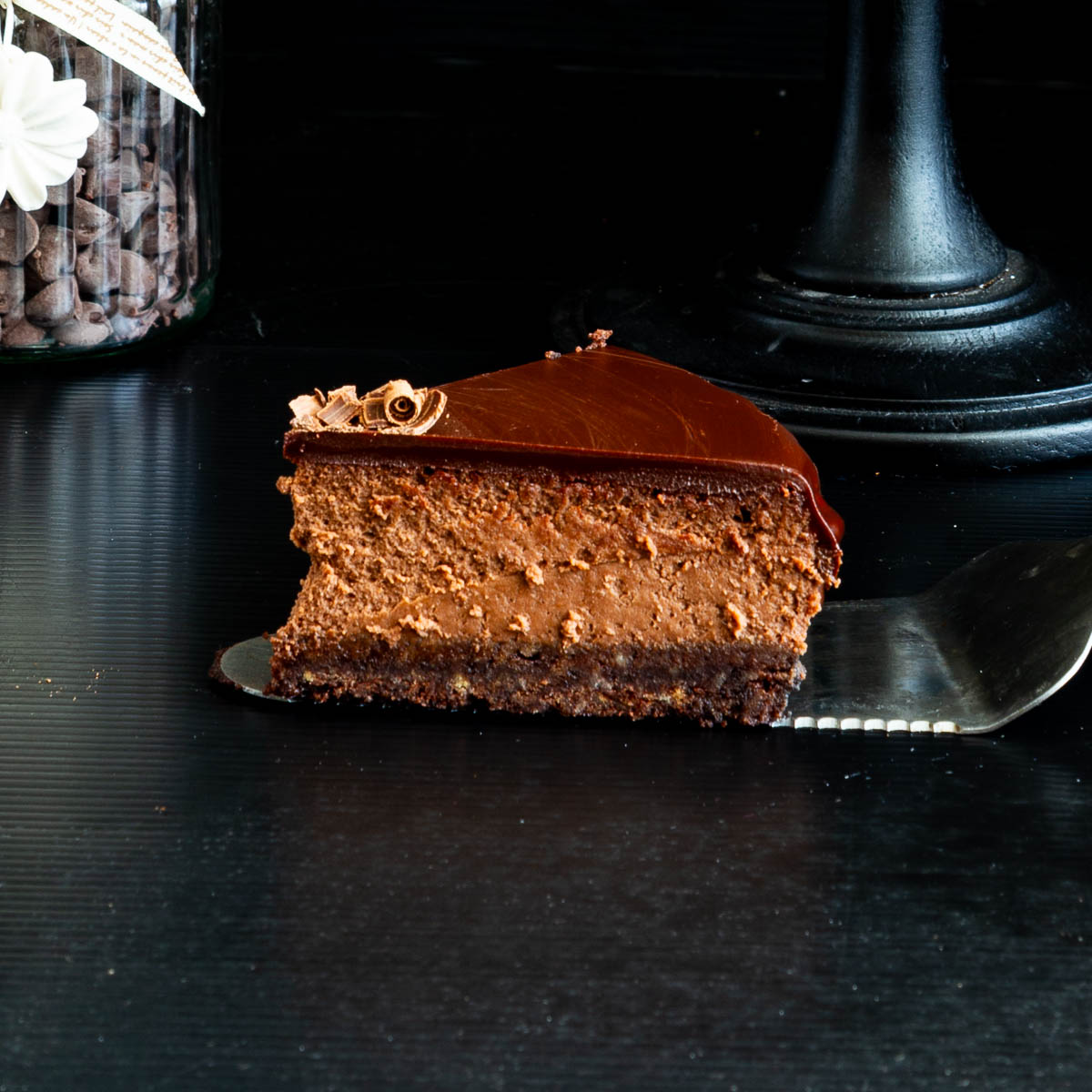 A slice of baked cheesecake on the table.