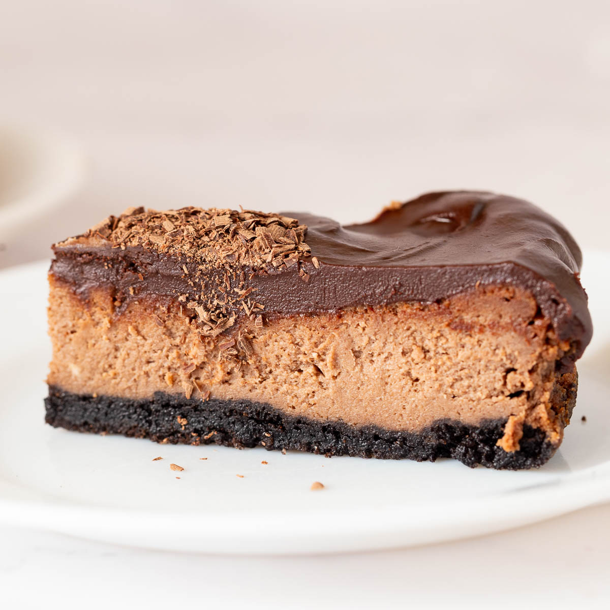 A slice of baked chocolate on the cake stand.