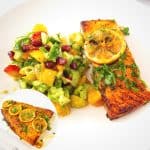 A plate with salmon fillet cooked in the oven.